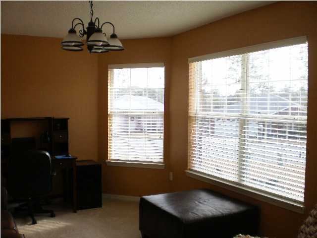 267 Limestone Circle Crestview, FL 32539 - Photo 4 of 9 a room with a window and a bicycle