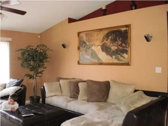 267 Limestone Circle Crestview, FL 32539 - Photo 6 of 9 a living room with furniture and a painting