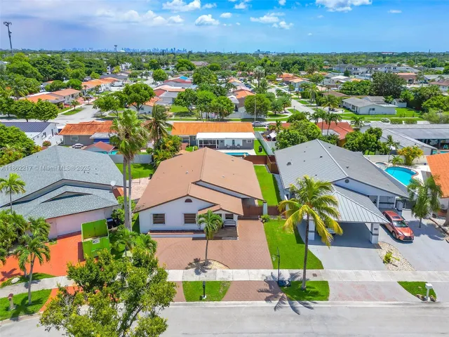 an aerial view of a house with a garden