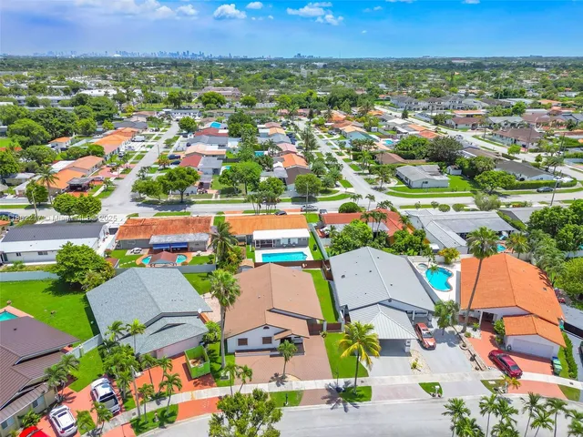 an aerial view of residential houses and outdoor space