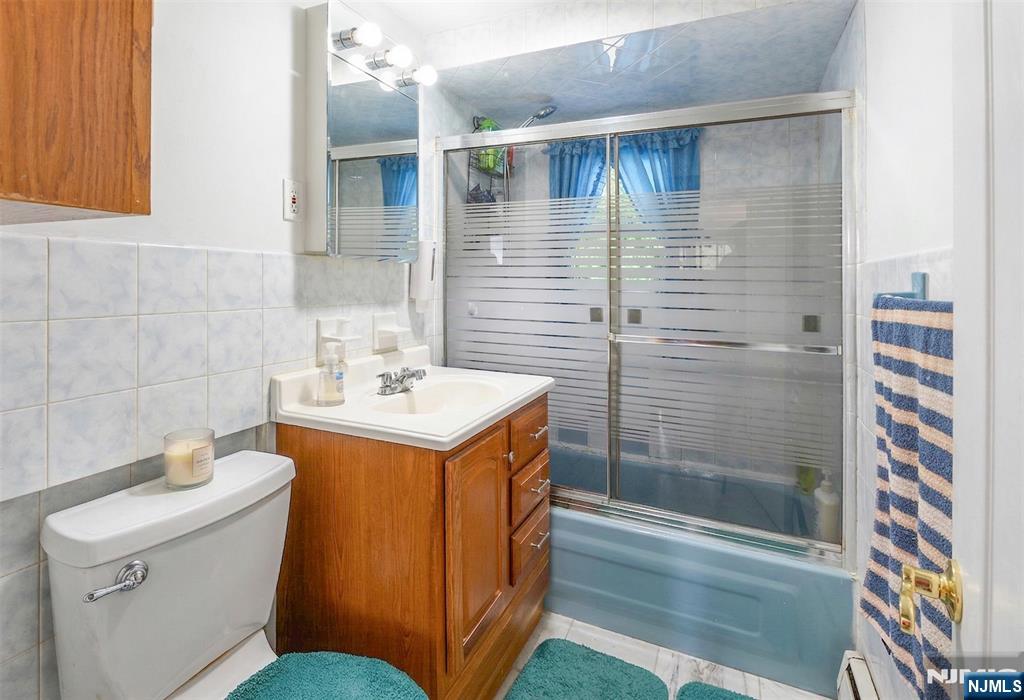 34 Lakeview Avenue Butler, NJ 07405 - Photo 11 of 30 a bathroom with a sink a toilet and shower
