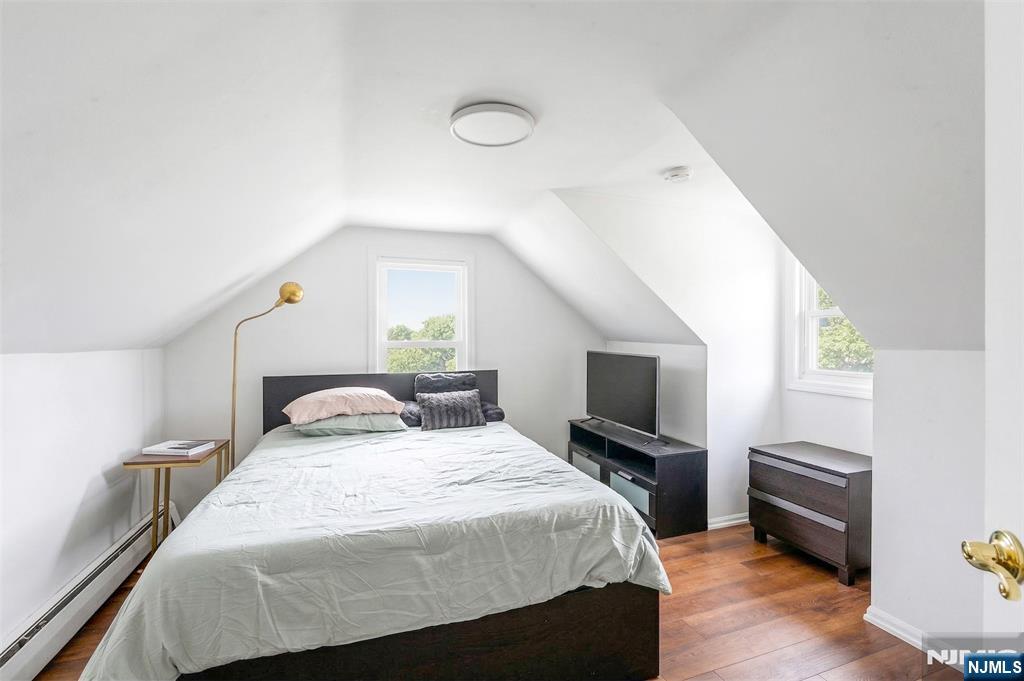 34 Lakeview Avenue Butler, NJ 07405 - Photo 22 of 30 a bedroom with a bed and a flat screen tv