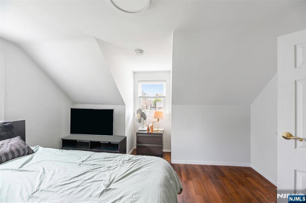 34 Lakeview Avenue Butler, NJ 07405 - Photo 23 of 30 a bedroom with a bed and a flat screen tv