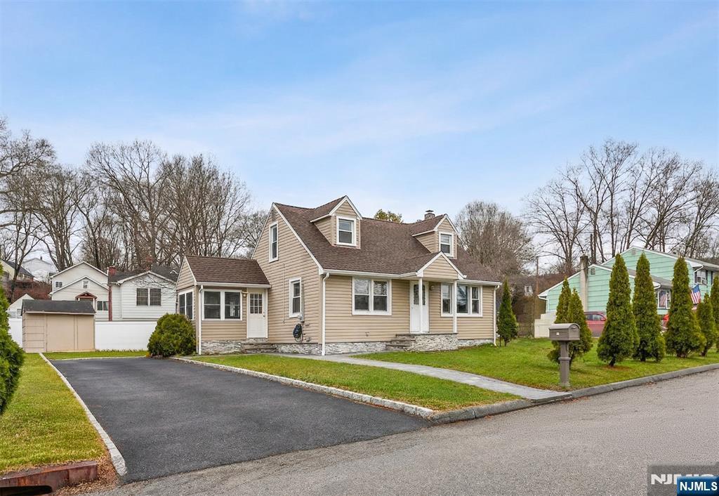 34 Lakeview Avenue Butler, NJ 07405 - Photo 25 of 30 a front view of a house with a yard