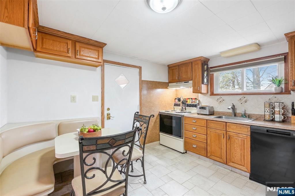 34 Lakeview Avenue Butler, NJ 07405 - Photo 5 of 30 a kitchen with stainless steel appliances kitchen island granite countertop a sink and cabinets