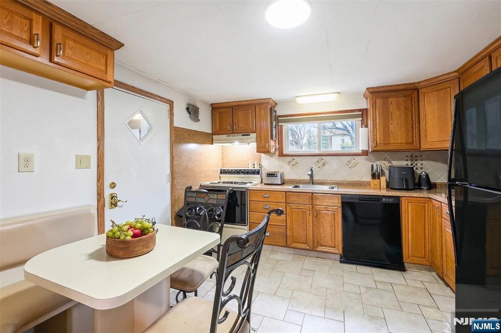 34 Lakeview Avenue Butler, NJ 07405 - Photo 6 of 30 a kitchen with a refrigerator and a stove top oven