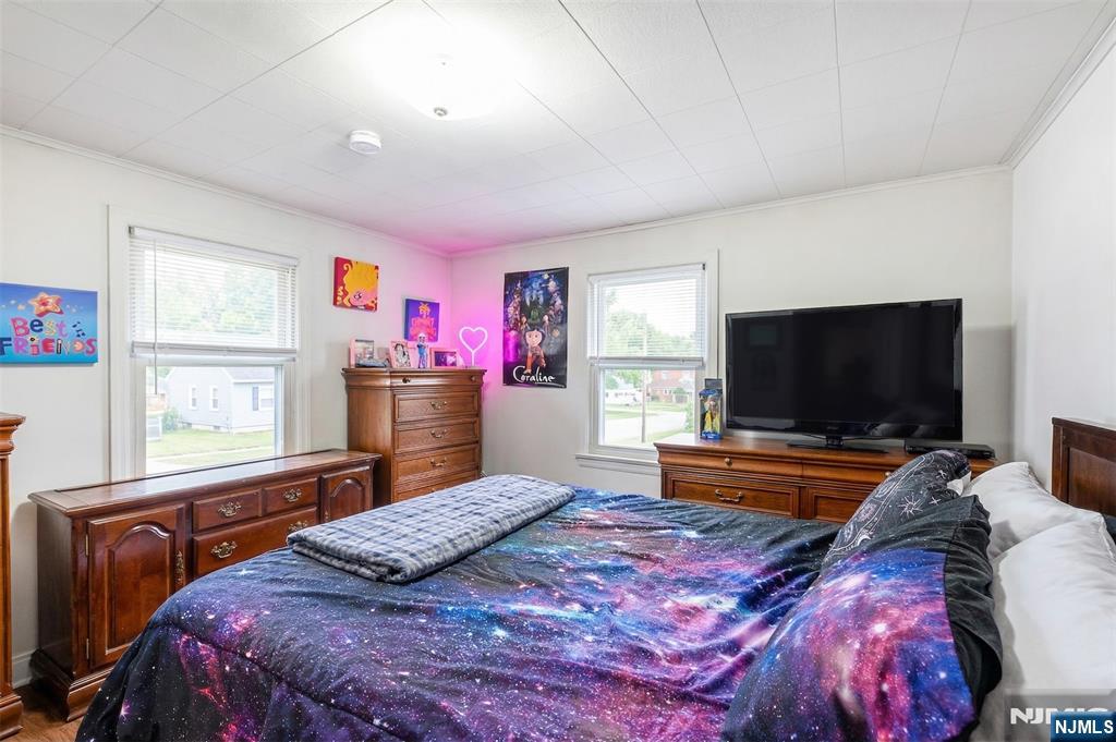 34 Lakeview Avenue Butler, NJ 07405 - Photo 8 of 30 a bedroom with a bed and a flat screen tv