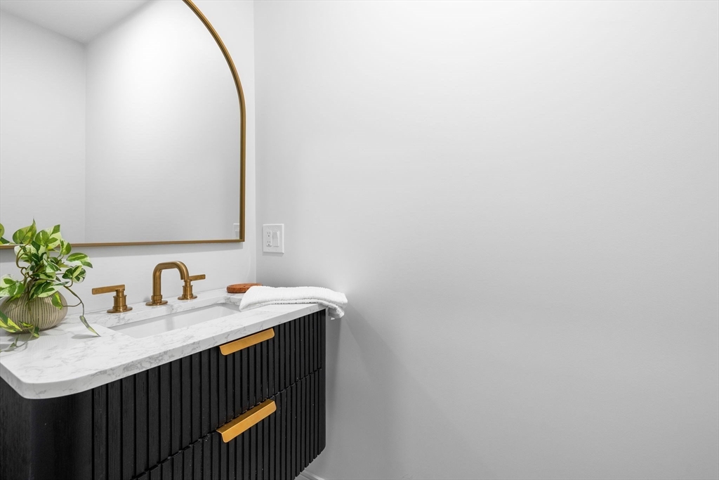 54 Springfield Street, Unit 1 Somerville, MA 02143 - Photo 14 of 38 a bathroom with a sink and a mirror