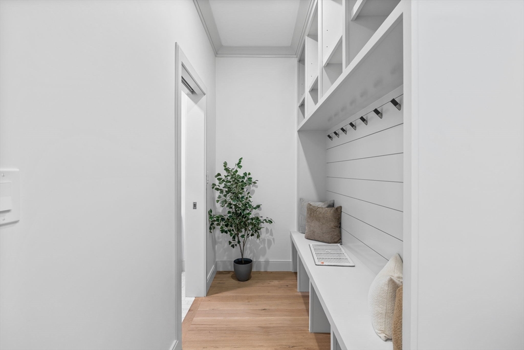 54 Springfield Street, Unit 1 Somerville, MA 02143 - Photo 15 of 38 a hallway with flowers and entryway