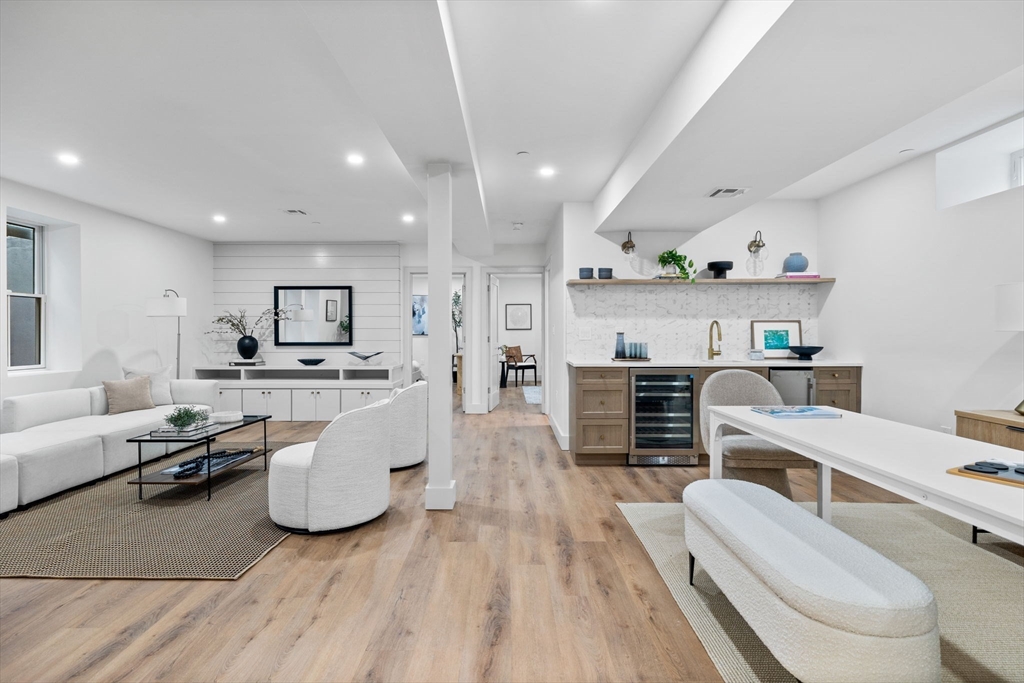 54 Springfield Street, Unit 1 Somerville, MA 02143 - Photo 17 of 38 a living room with furniture and a wooden floor