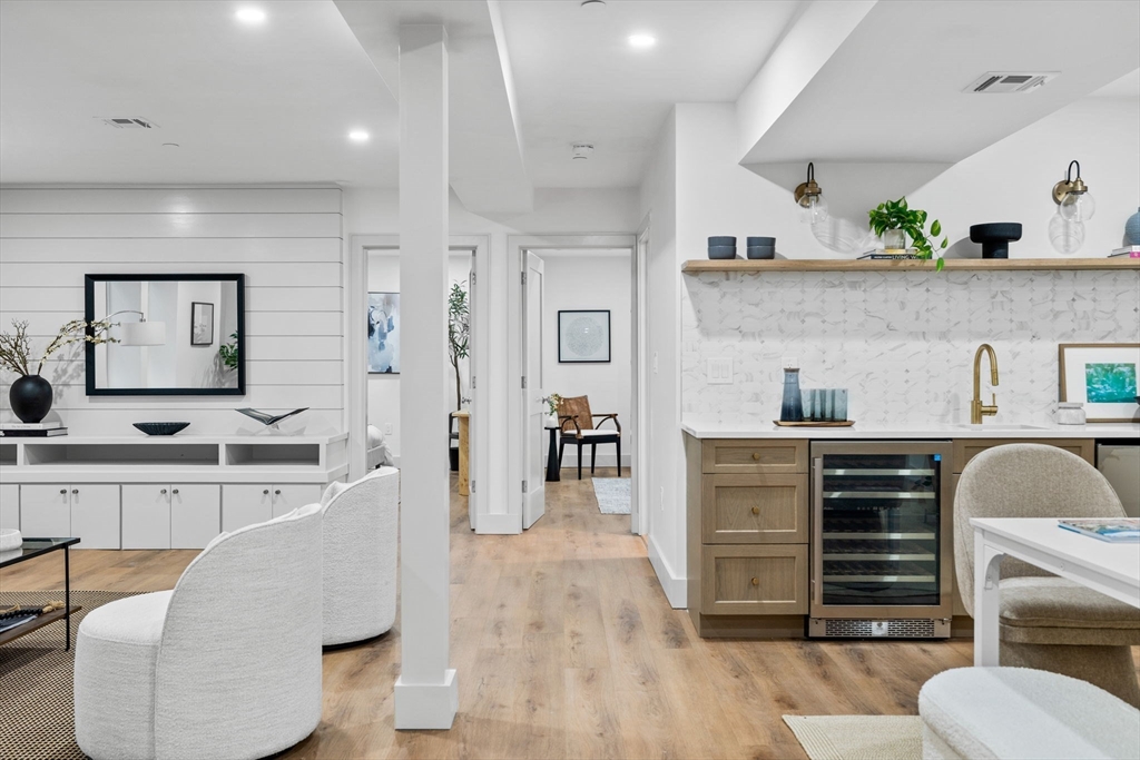 54 Springfield Street, Unit 1 Somerville, MA 02143 - Photo 18 of 38 a living room with furniture and wooden floor
