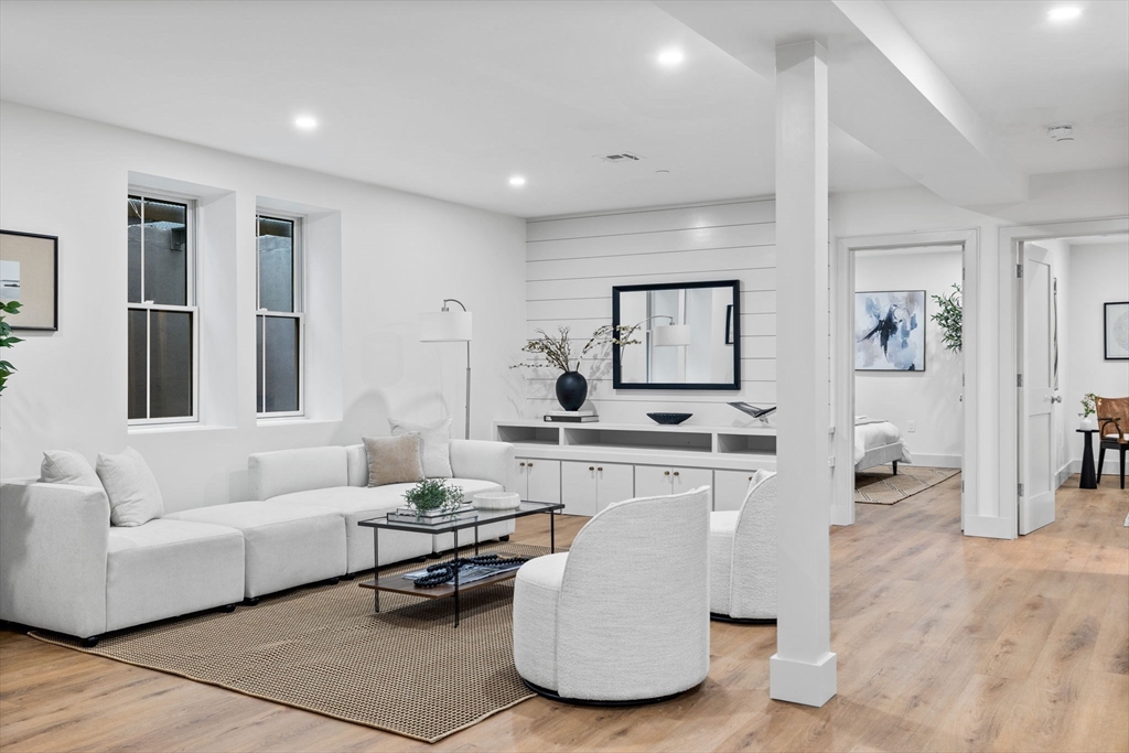 54 Springfield Street, Unit 1 Somerville, MA 02143 - Photo 19 of 38 a living room with furniture a view of bedroom and a couch