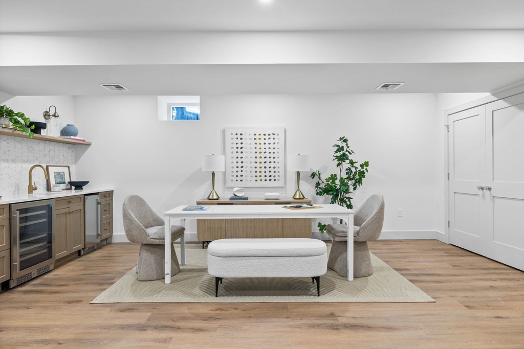 54 Springfield Street, Unit 1 Somerville, MA 02143 - Photo 21 of 38 a view of a dining room with furniture window and wooden floor
