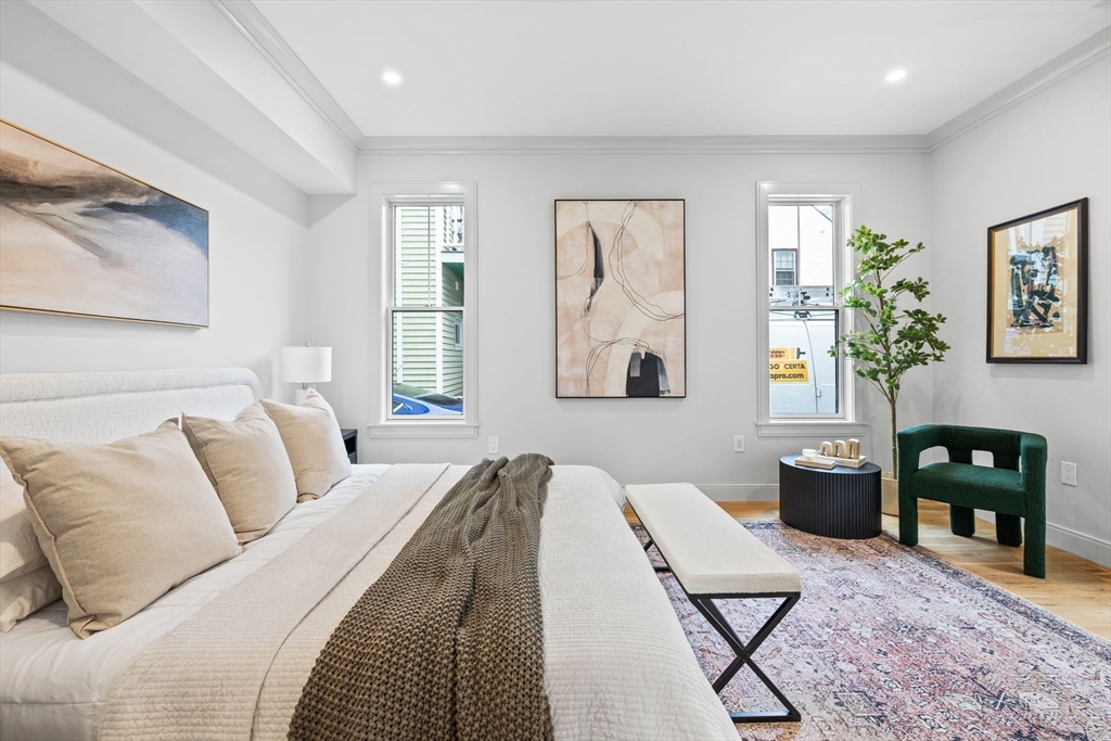 54 Springfield Street, Unit 1 Somerville, MA 02143 - Photo 32 of 38 a living room with furniture and wooden floor