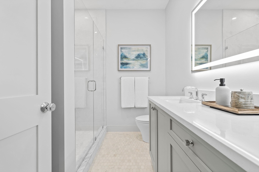 54 Springfield Street, Unit 1 Somerville, MA 02143 - Photo 35 of 38 a bathroom with a sink and a mirror