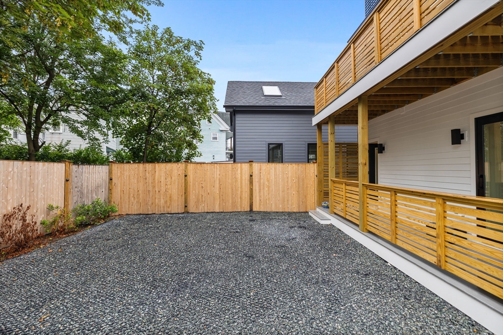 54 Springfield Street, Unit 1 Somerville, MA 02143 - Photo 37 of 38 a view of a backyard with pathway