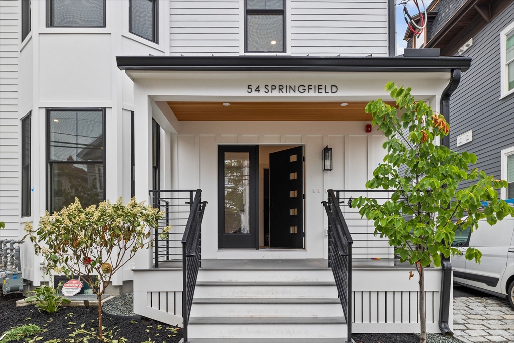 54 Springfield Street, Unit 1 Somerville, MA 02143 - Photo 38 of 38 a view of a building with potted plants