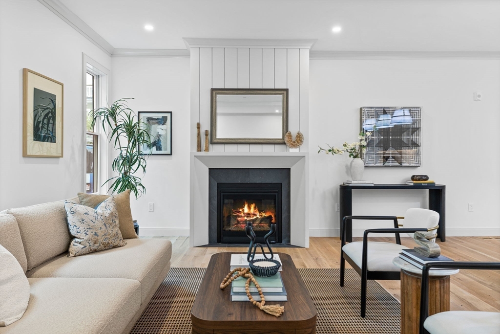 54 Springfield Street, Unit 1 Somerville, MA 02143 - Photo 7 of 38 a living room with furniture and a fireplace