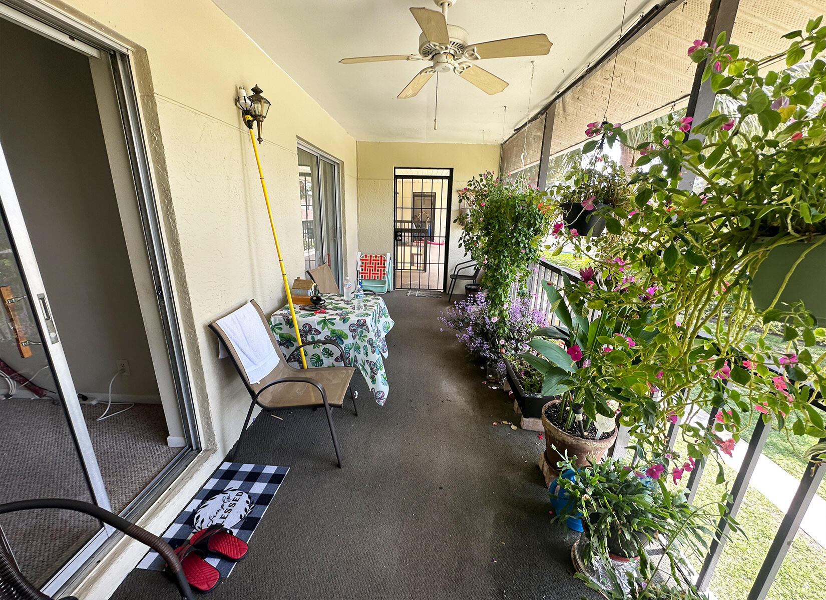 6543 Chasewood Drive, Unit E Jupiter, FL 33458 - Photo 11 of 15 Screened Balcony Patio to Entry