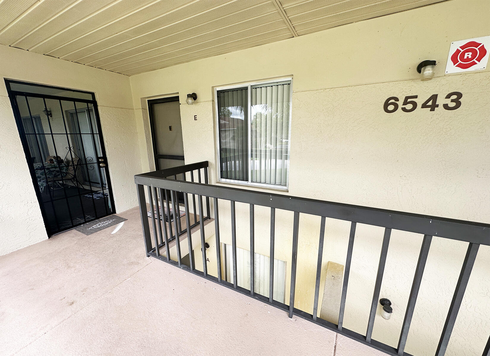 6543 Chasewood Drive, Unit E Jupiter, FL 33458 - Photo 15 of 15 Entry Walkup to 6543-E Chasewood