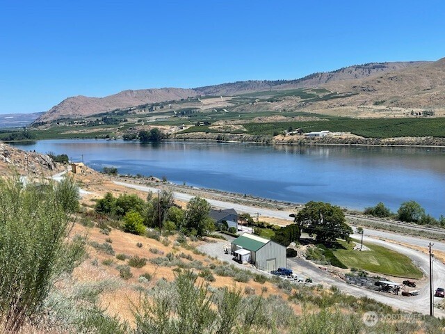 37 Osprey Nest Road Pateros, WA 98846 - Photo 3 of 13 a view of a lake with mountains in the background