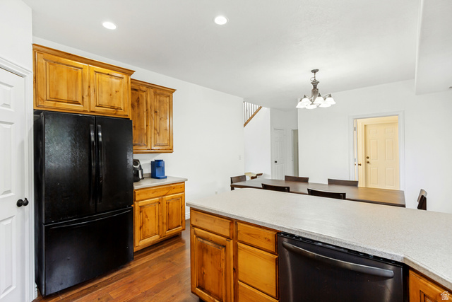 1585 South 910 West Payson, UT 84651 - Photo 10 of 32 Kitchen featuring wood-finish cabinetry, light-toned countertops, and a black appliance suite