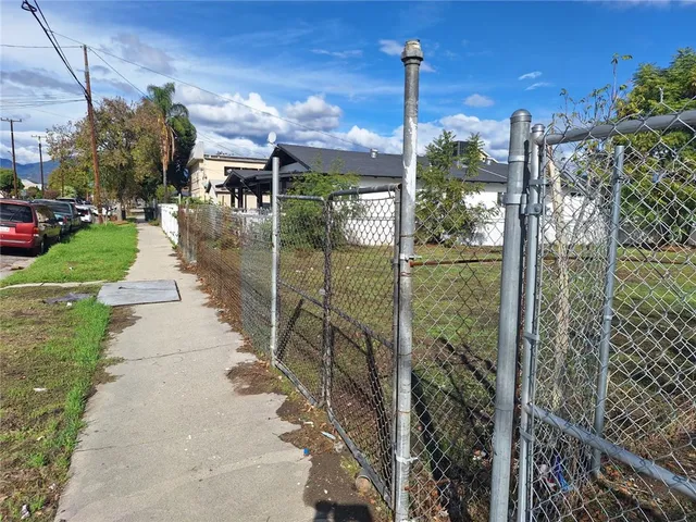 a view of a street with a building in the background