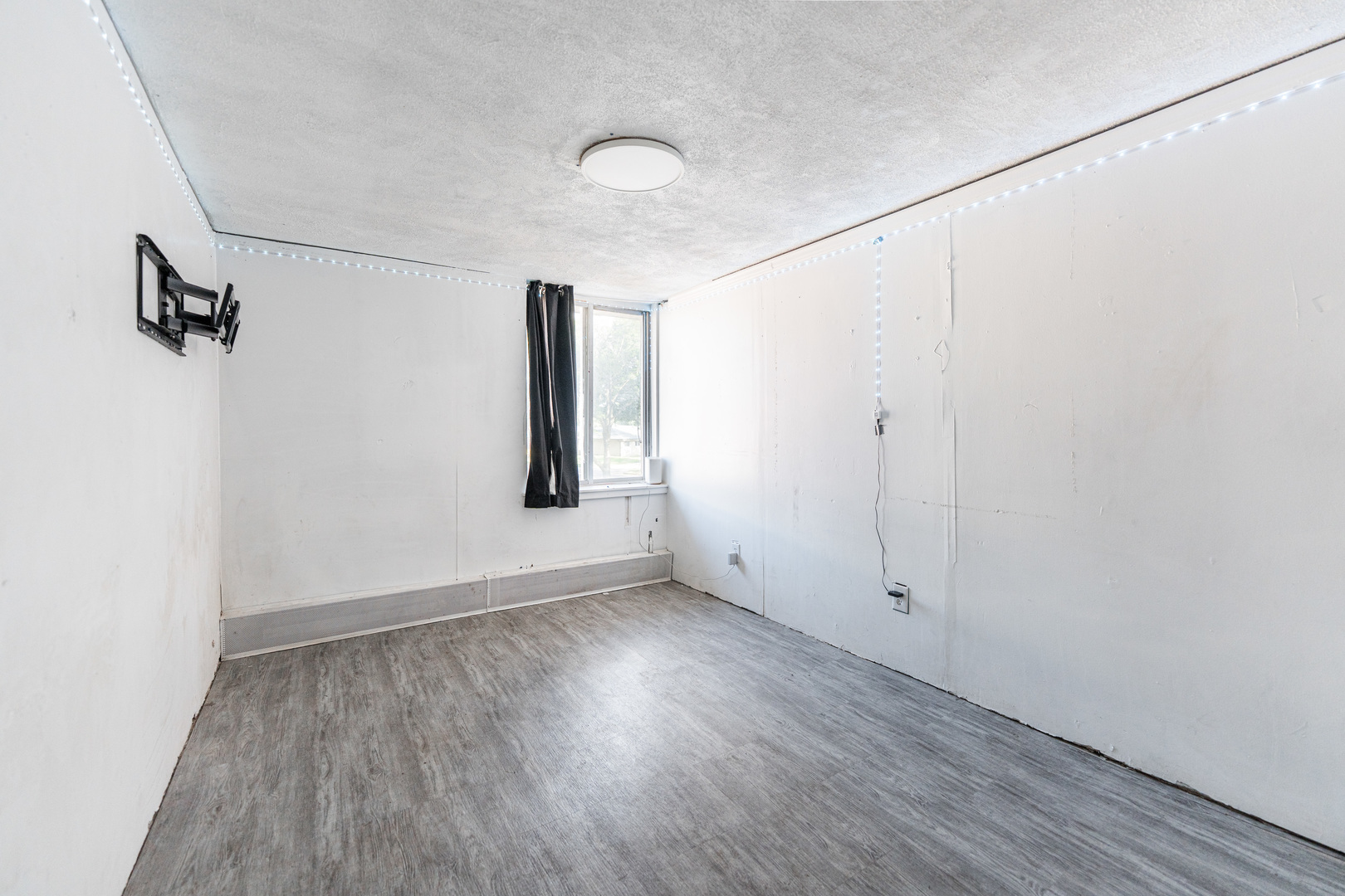 919 Greenbrier Road DeKalb, IL 60115 - Photo 17 of 23 an empty room with wooden floor and windows