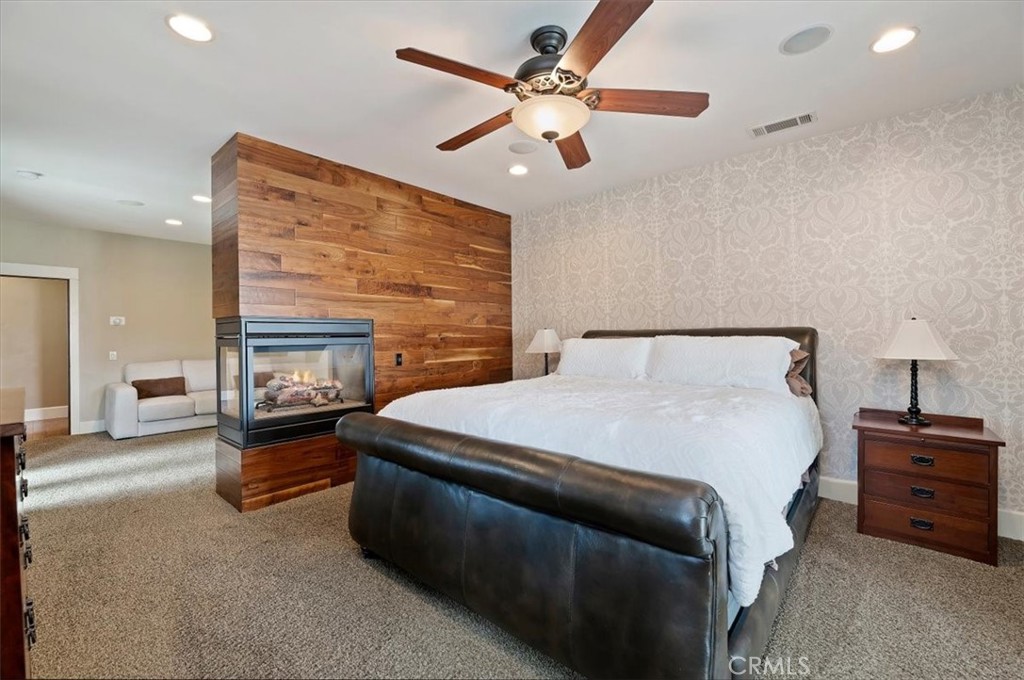 16420 Rocky Glen Road Perris, CA 92570 - Photo 29 of 74 a bedroom with a bed and a ceiling fan