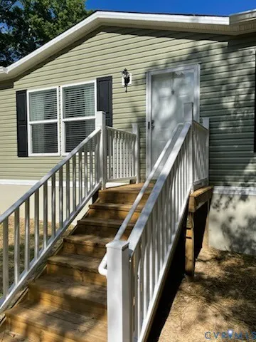 a view of staircase with wooden floor and fence