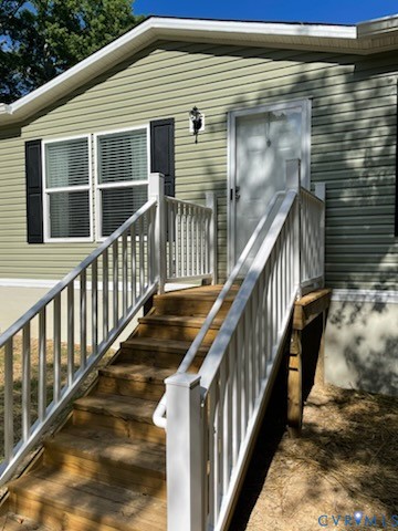 a view of staircase with wooden floor and fence