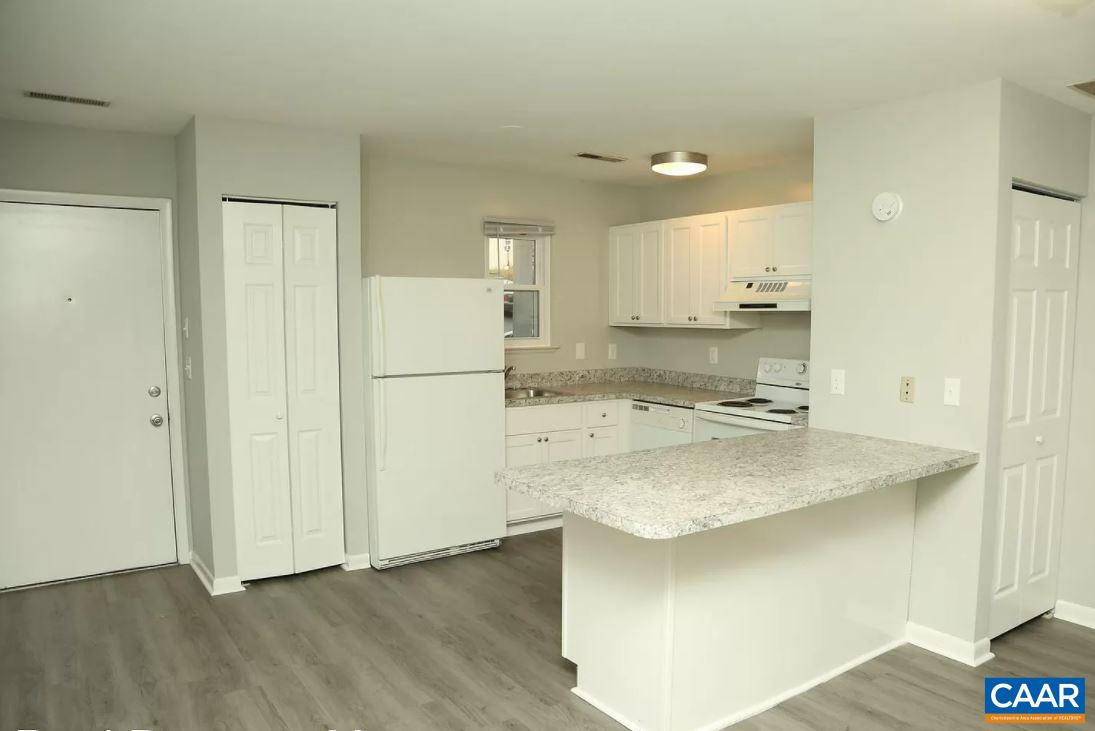 101 Westerly Avenue Charlottesville, VA 22903 - Photo 4 of 10 a kitchen with kitchen island a sink stainless steel appliances and cabinets