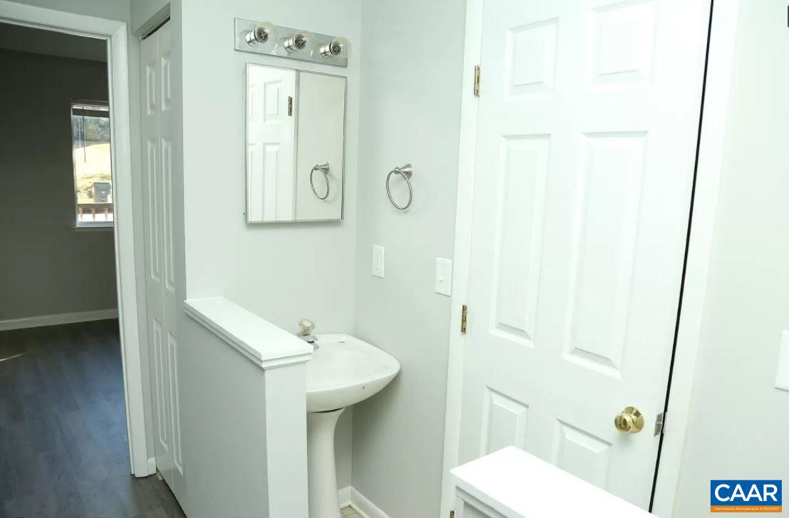 101 Westerly Avenue Charlottesville, VA 22903 - Photo 7 of 10 a bathroom with a sink a toilet and shower