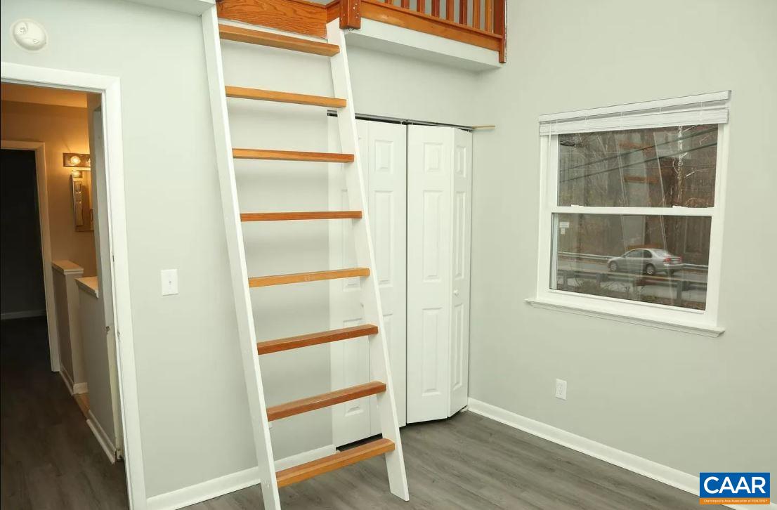 101 Westerly Avenue Charlottesville, VA 22903 - Photo 8 of 10 a view of an empty room with wooden floor and a window