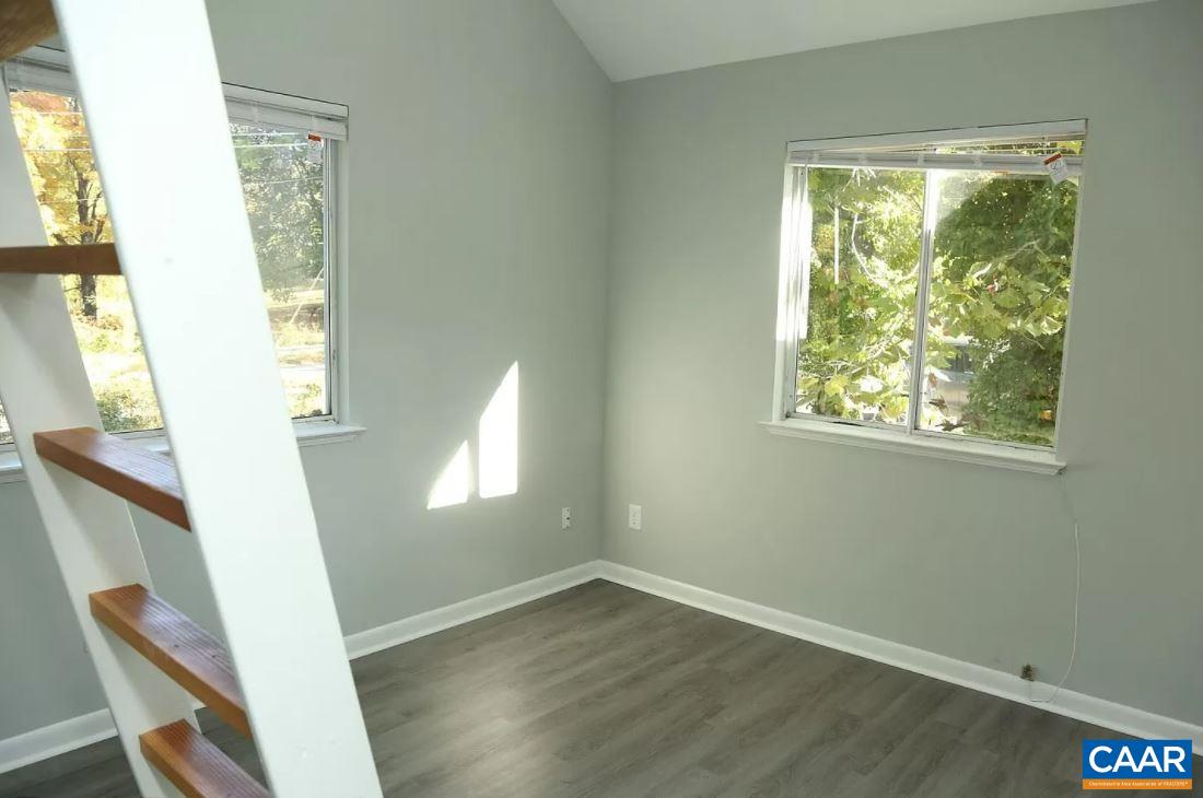 101 Westerly Avenue Charlottesville, VA 22903 - Photo 9 of 10 a view of an entryway with wooden floor and windows
