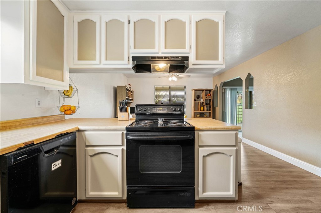 19425 Old Creek Road Hidden Valley Lake, CA 95467 - Photo 15 of 42 a kitchen with granite countertop a stove and a sink