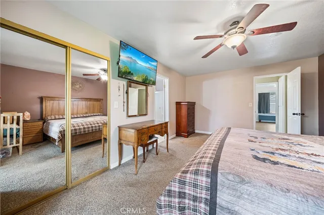 a bedroom with furniture and a window