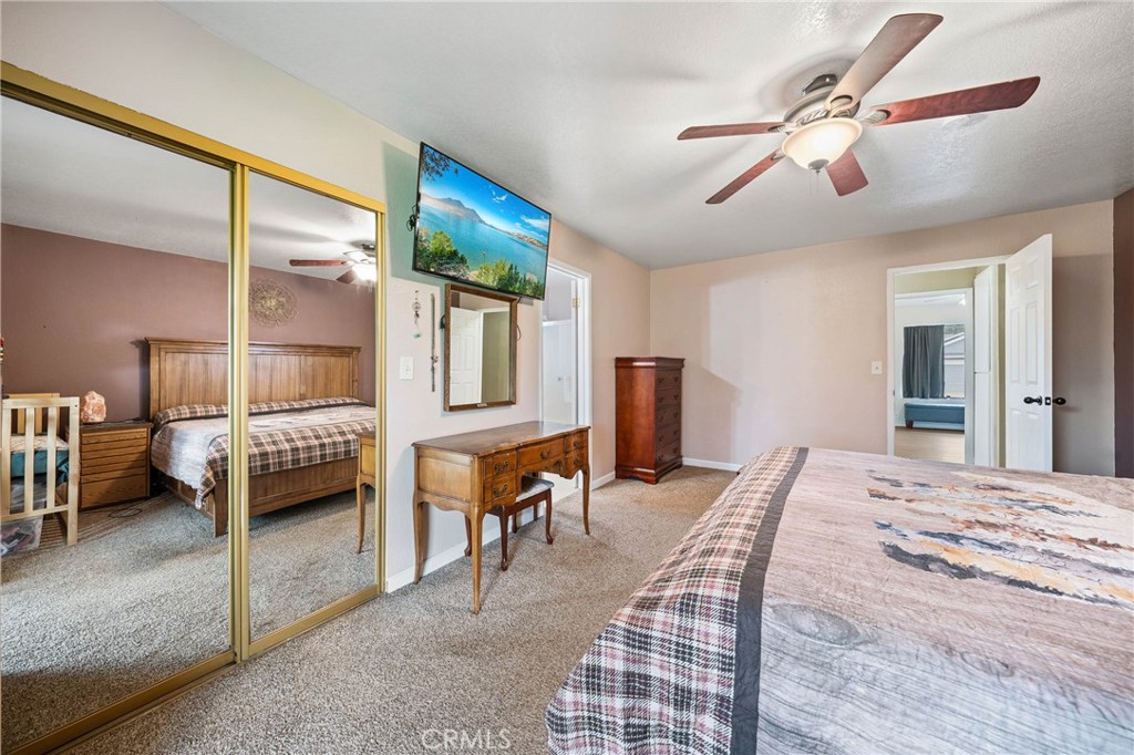 19425 Old Creek Road Hidden Valley Lake, CA 95467 - Photo 19 of 42 a bedroom with furniture and a window