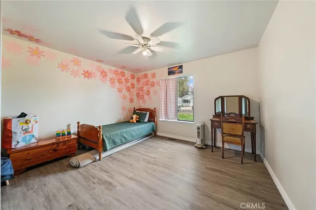 a bedroom with furniture and a window