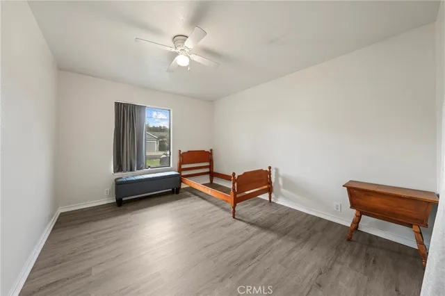 a view of a livingroom with furniture and a workspace