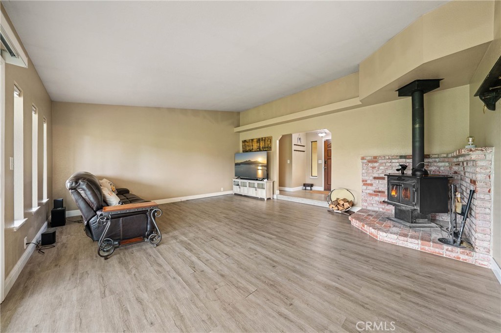 19425 Old Creek Road Hidden Valley Lake, CA 95467 - Photo 9 of 42 a living room with furniture and a fireplace
