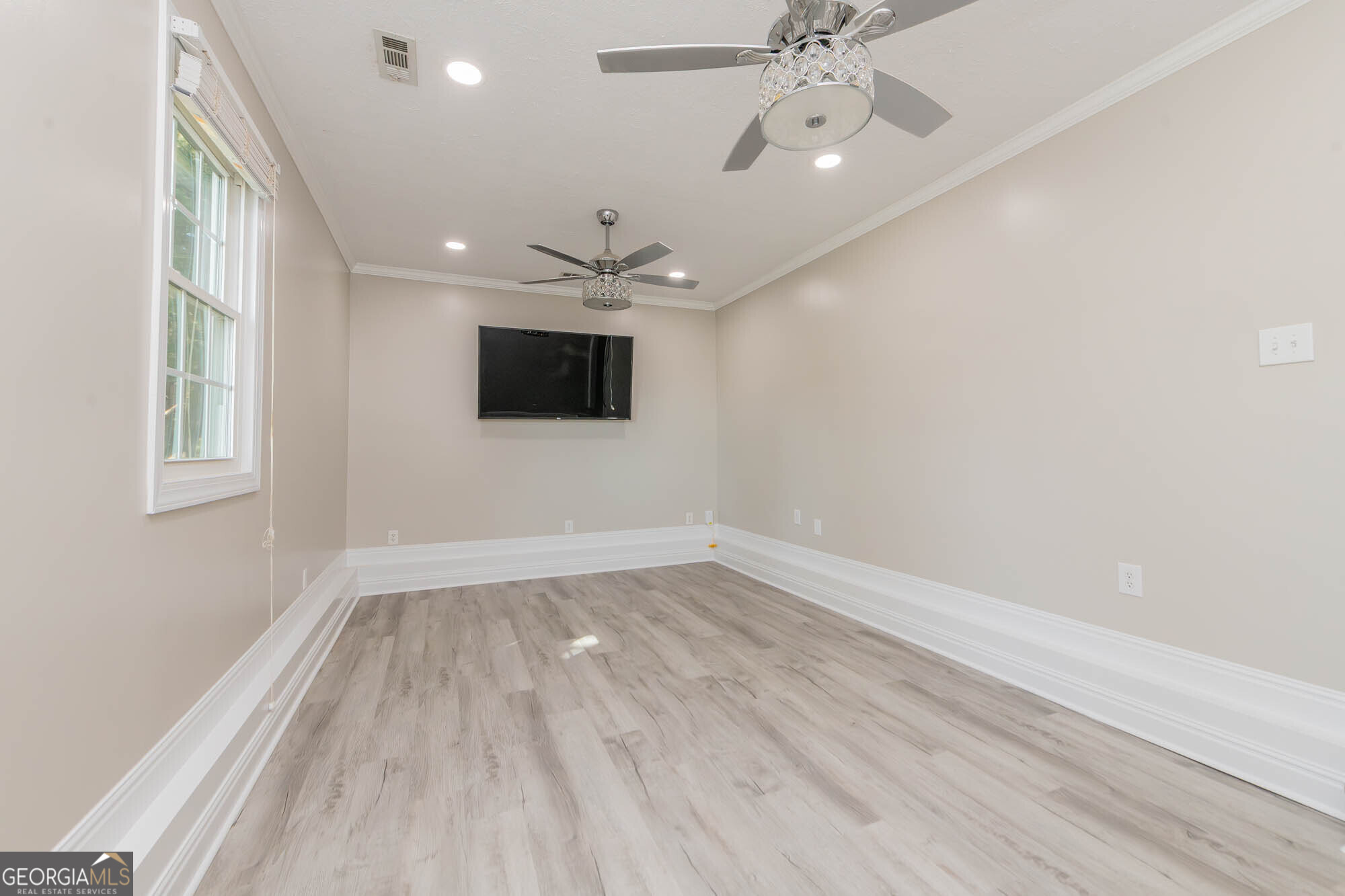 1661 Mule Creek Road Byron, GA 31008 - Photo 11 of 33 wooden floor in an empty room with a window