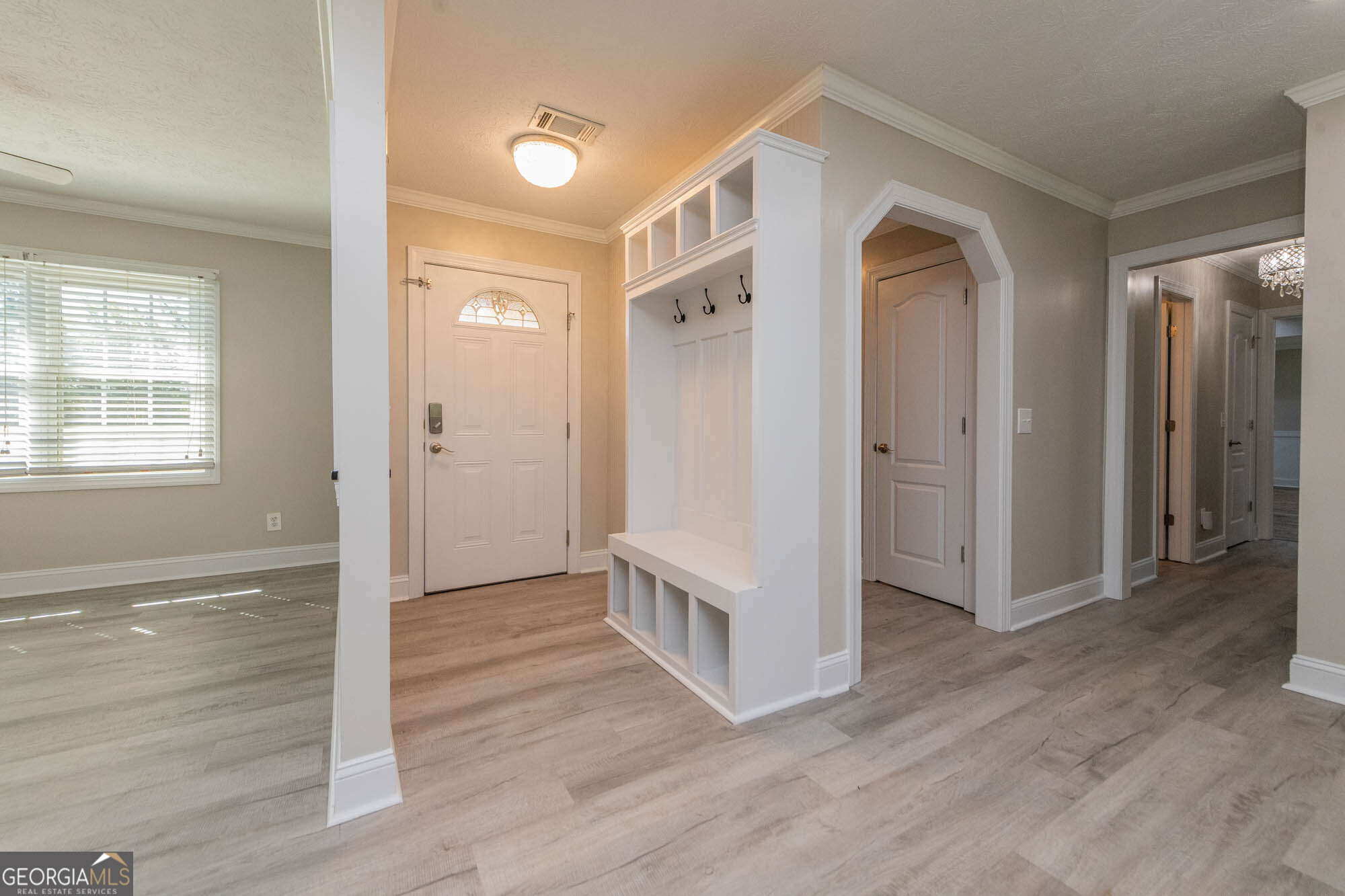 1661 Mule Creek Road Byron, GA 31008 - Photo 16 of 33 a view of a hallway with wooden floor and closet area