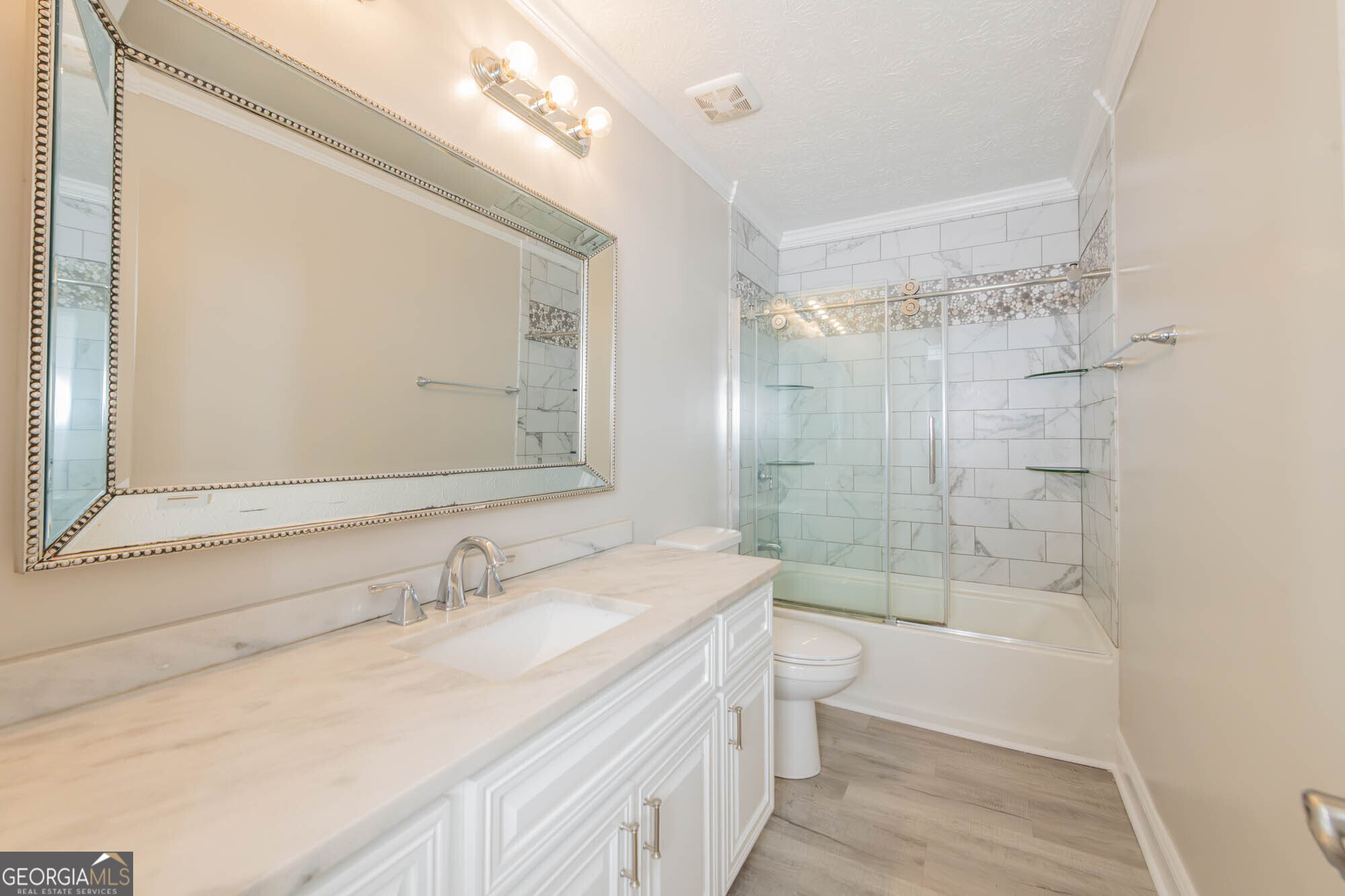 1661 Mule Creek Road Byron, GA 31008 - Photo 7 of 33 a bathroom with a granite countertop sink a toilet a shower and a mirror