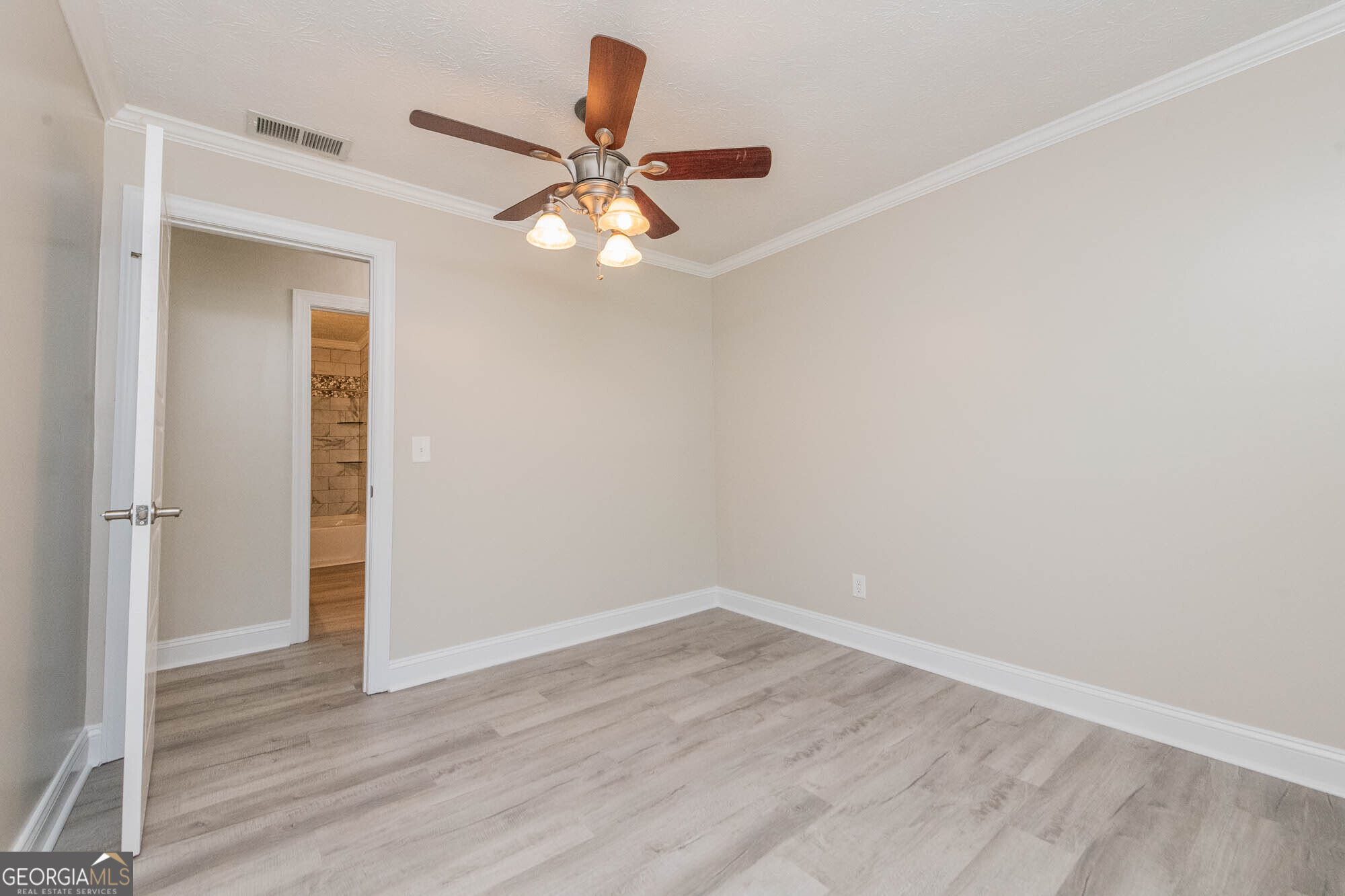 1661 Mule Creek Road Byron, GA 31008 - Photo 8 of 33 wooden floor in an empty room