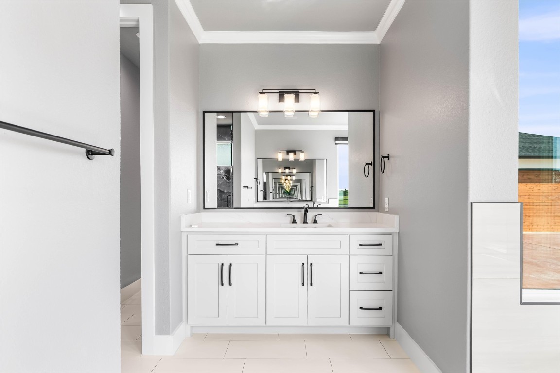 178 Balch Road Elgin, TX 78621 - Photo 18 of 40 a bathroom with a granite countertop sink and a mirror