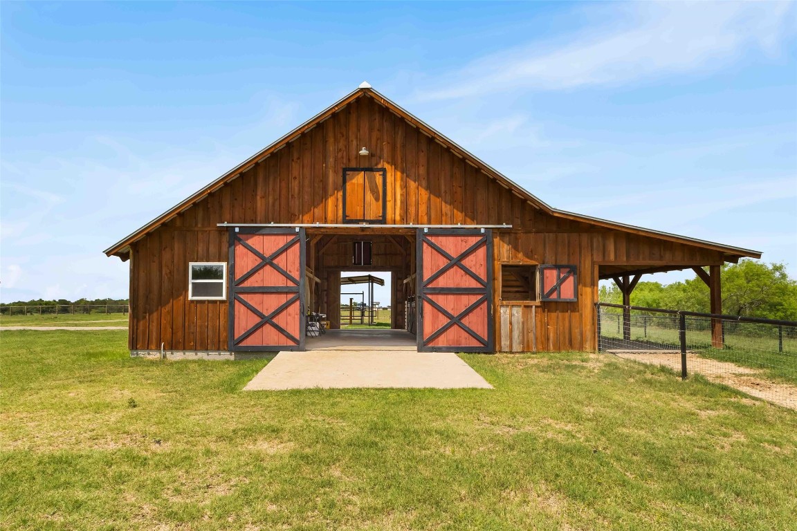 178 Balch Road Elgin, TX 78621 - Photo 33 of 40 a view of an house with backyard and a tree