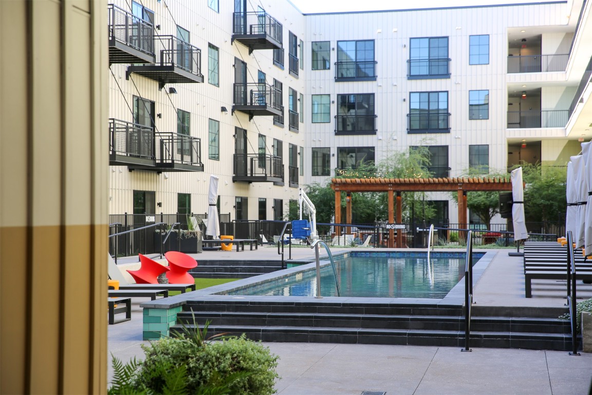 4315 South Congress Avenue, Unit 203 Austin, TX 78745 - Photo 14 of 15 a view of building with an outdoor space