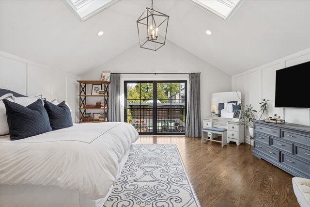 a bedroom with furniture and a window