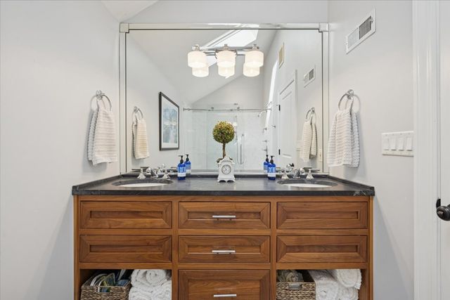 a view of a balcony with wooden floor and outdoor seating